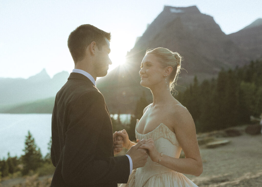 bride and groom taking photos for their sun point elopement