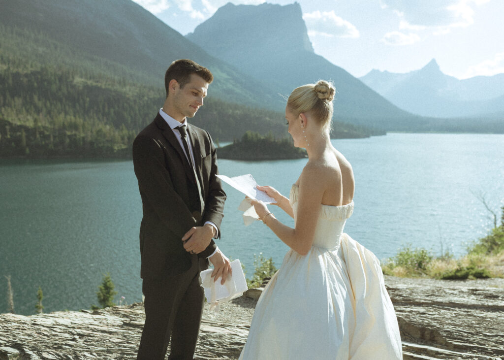 bride and groom reading vows at their sun point elopement