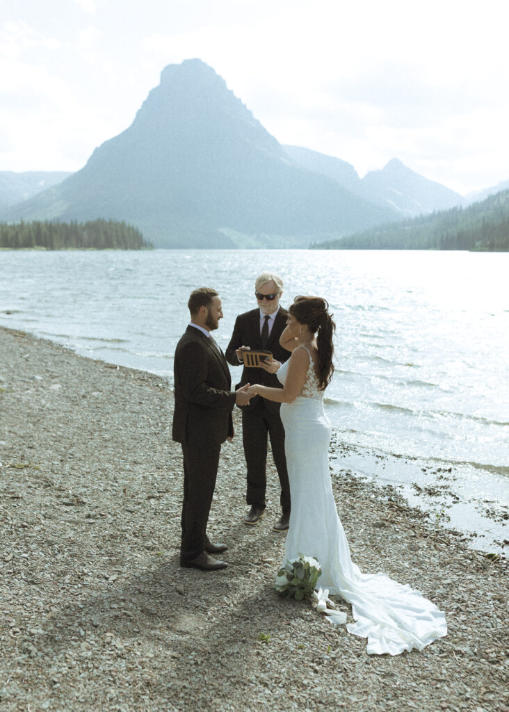 couple reading their vows for their Two Medicine Lake Elopement 