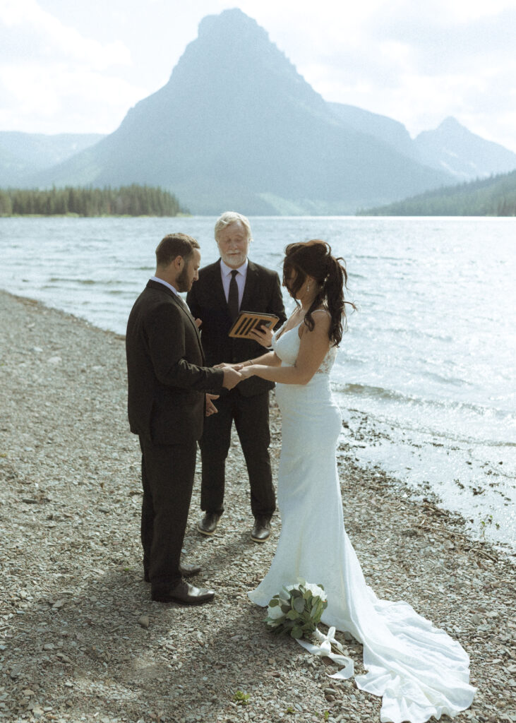 couple reading their vows for their Two Medicine Lake Elopement 