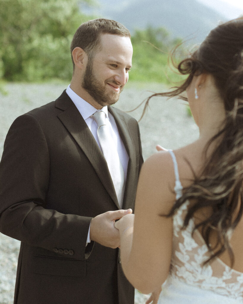 couple reading their vows for their Two Medicine Lake Elopement 