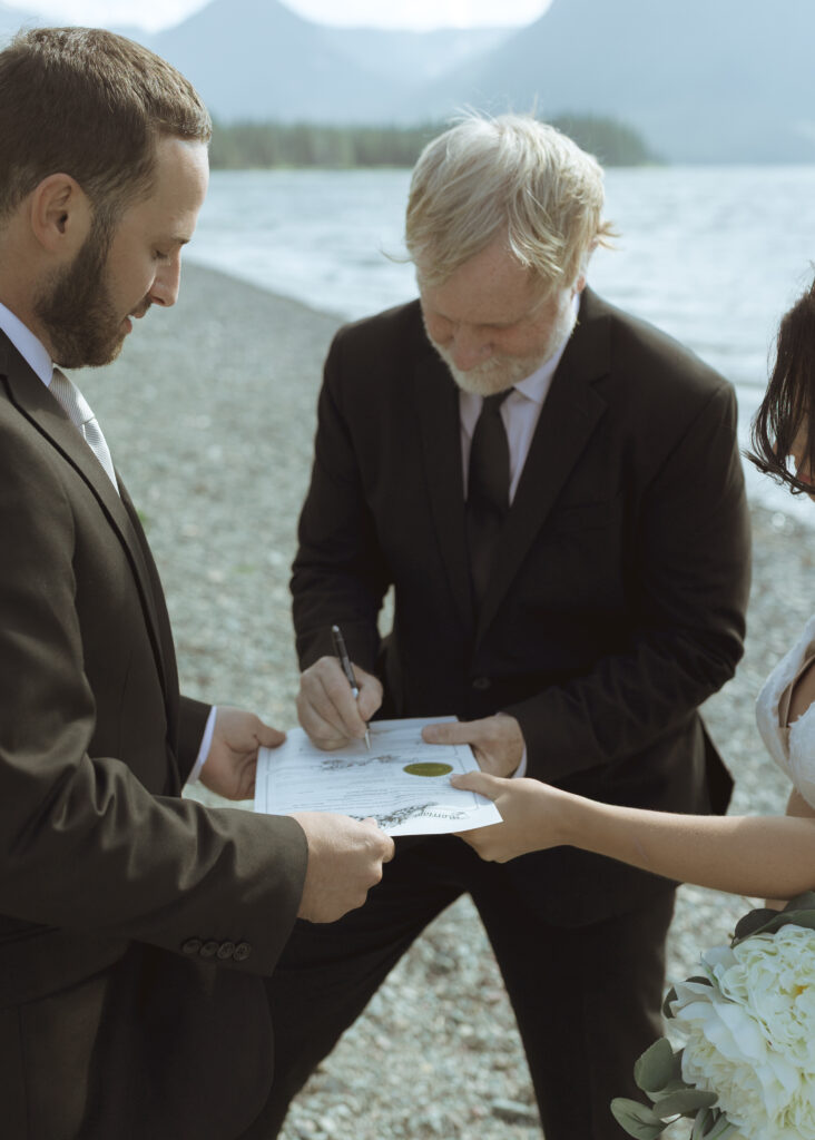 couple reading their vows for their Two Medicine Lake Elopement 