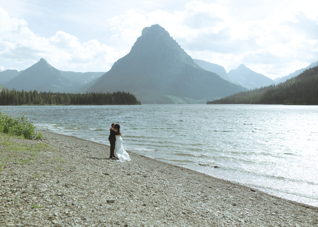 bride and groom at Two Medicine Lake 