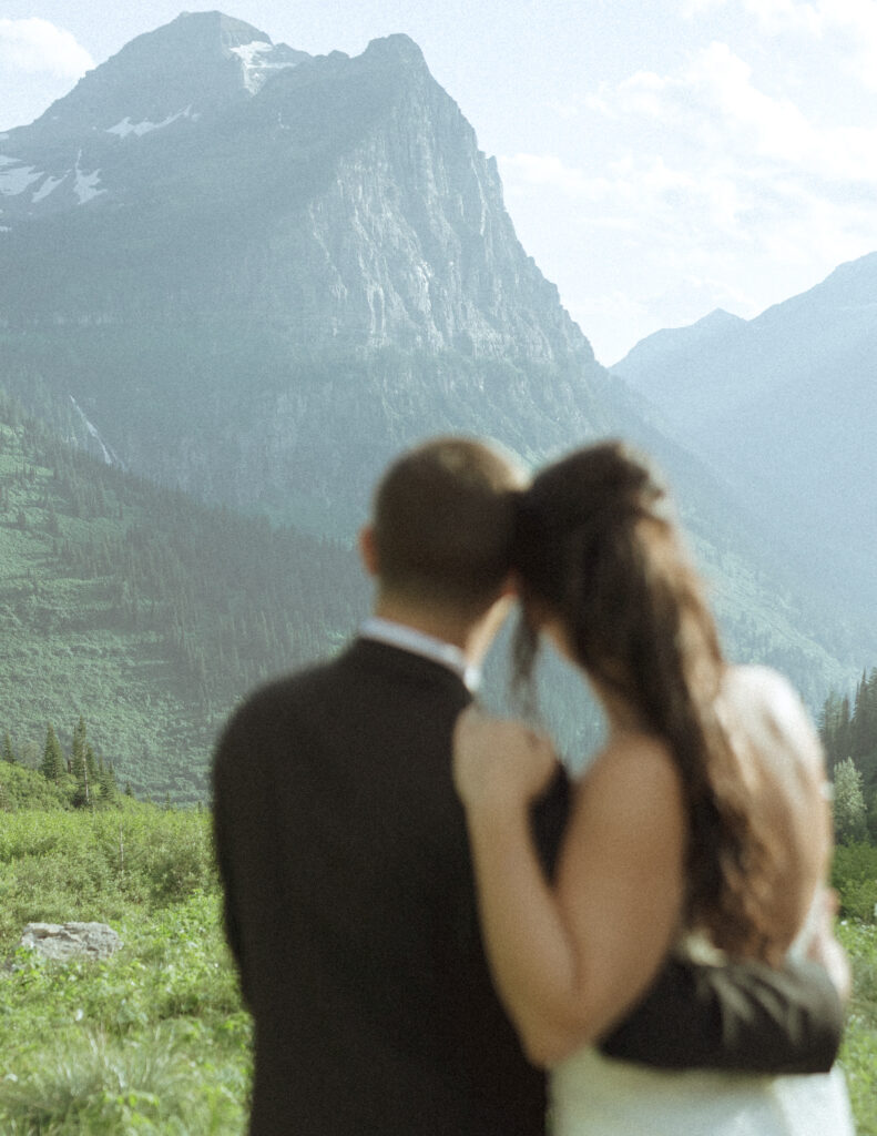couple exploring Glacier National Park after their Two Medicine Lake Elopement 
