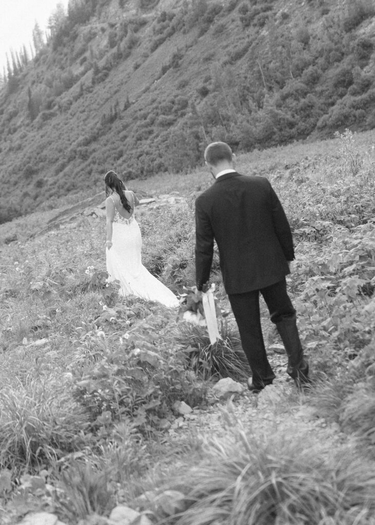 couple exploring Glacier National Park after their Two Medicine Lake Elopement 