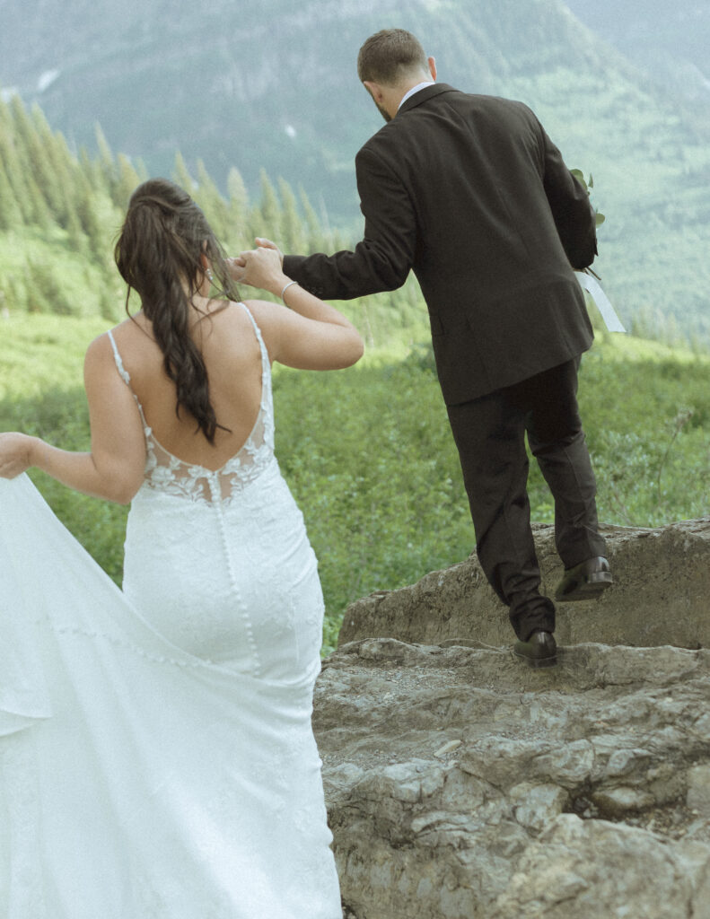 couple exploring Glacier National Park after their Two Medicine Lake Elopement 