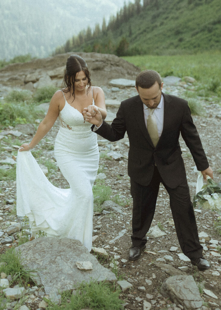 couple exploring Glacier National Park after their Two Medicine Lake Elopement 