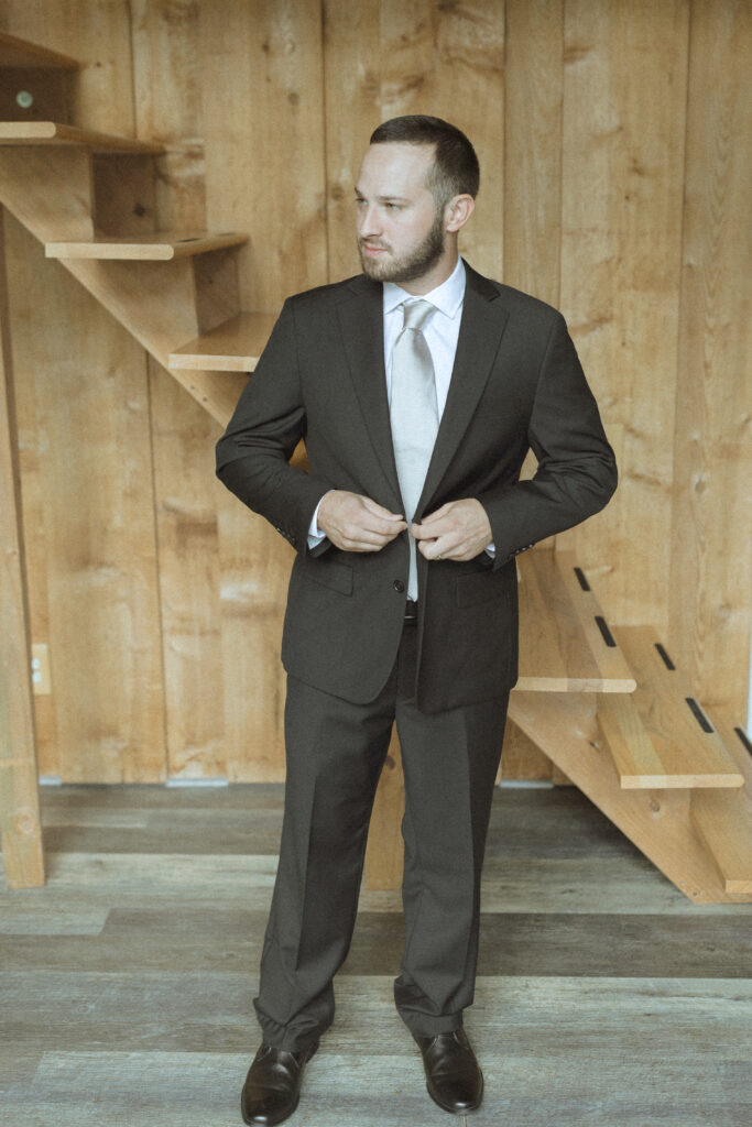 groom getting ready for his two Medicine Lake elopement 