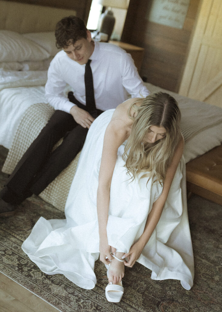 couple getting ready for their Wyoming horse elopement