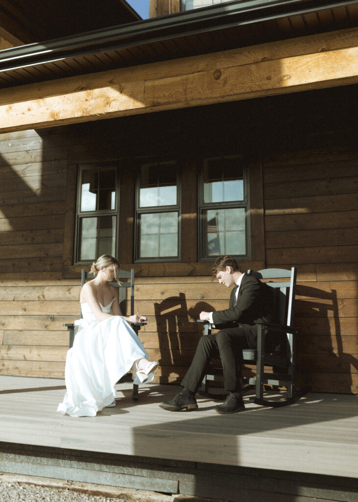 couple writing their vows for their Wyoming horse elopement
