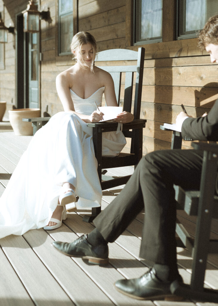 couple writing their vows for their Wyoming horse elopement
