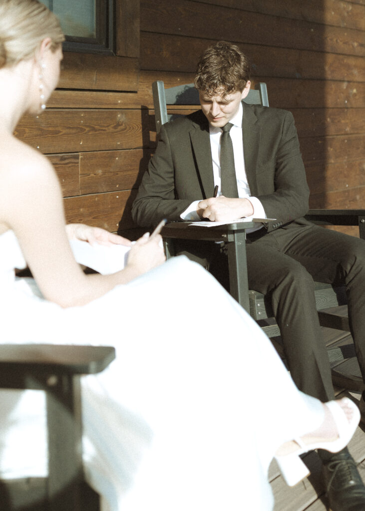 couple writing their vows for their Wyoming horse elopement