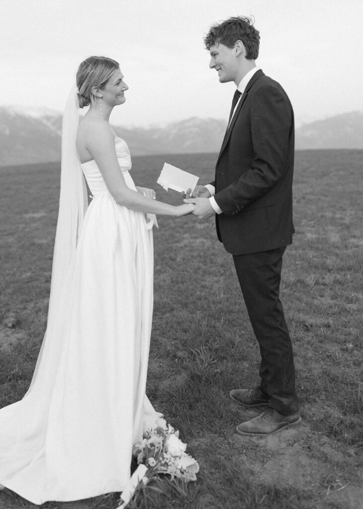 couple reading their vows for their Wyoming Horse Elopement