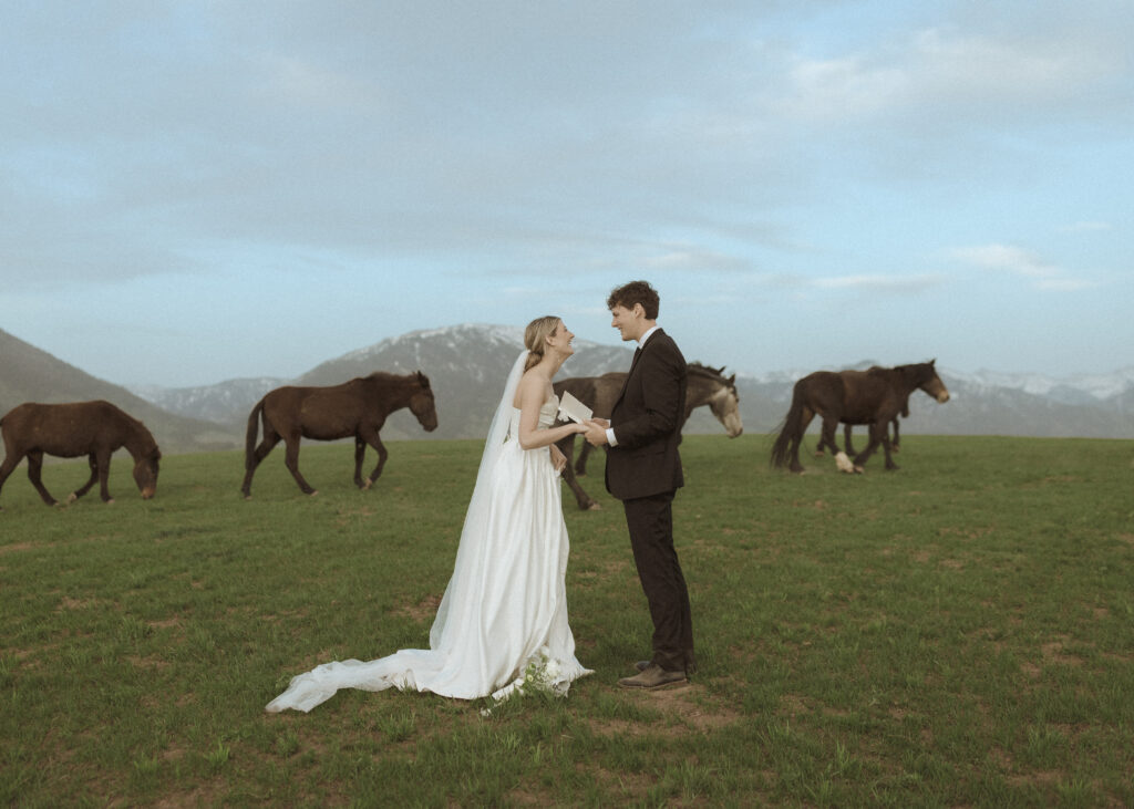 couple reading their vows for their Wyoming Horse Elopement