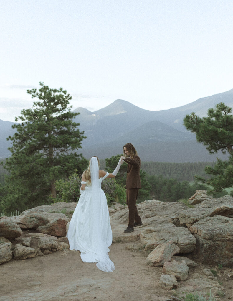 bride and groom taking photos for their 3m curve elopement 