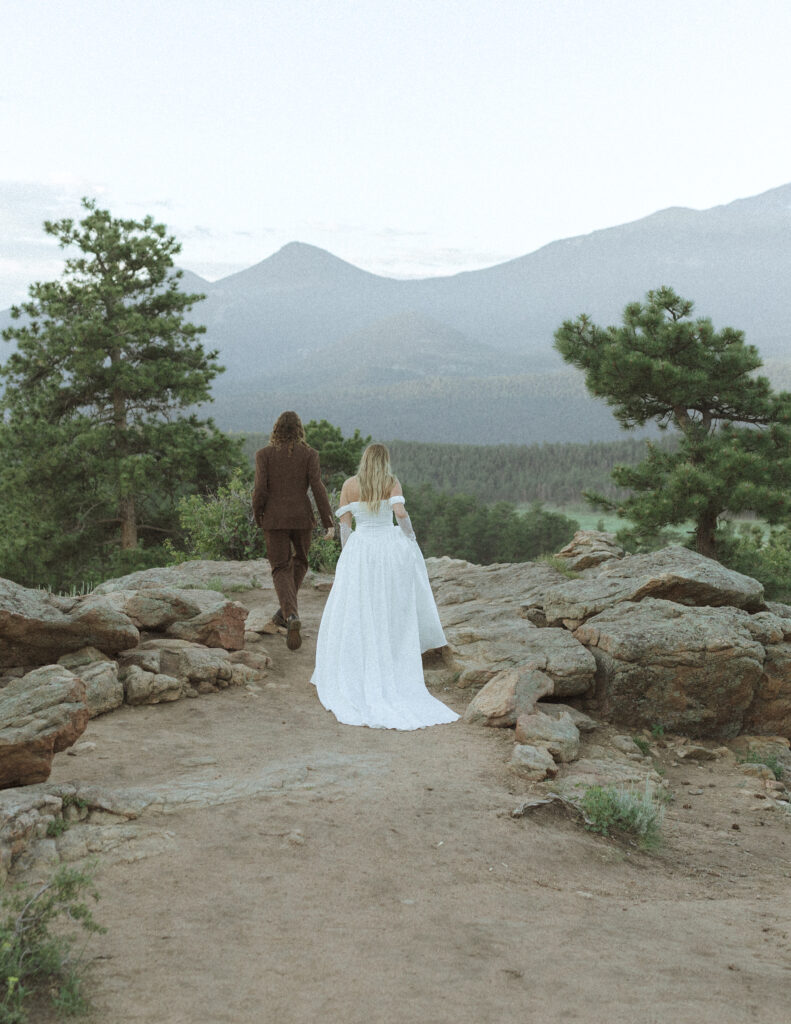 bride and groom taking photos for their 3m curve elopement 
