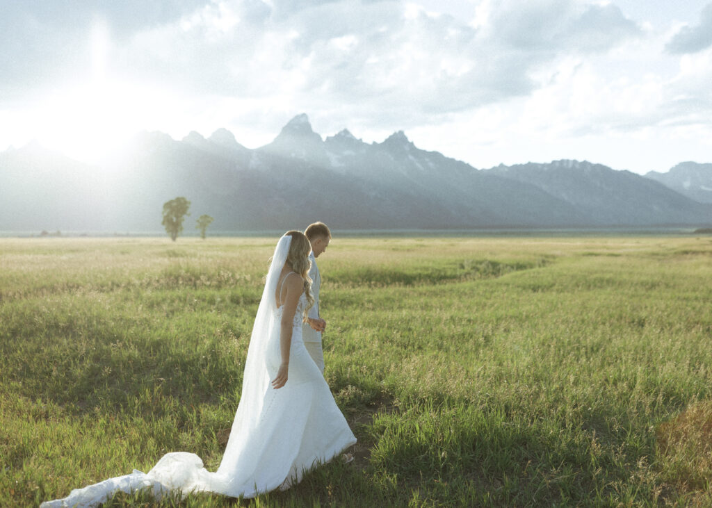 bride and groom taking wedding photos in Grand Teton National Park 