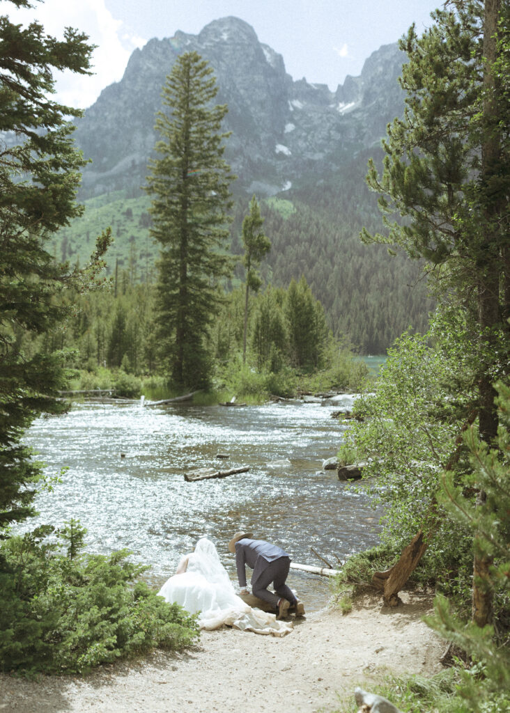 bride and groom taking wedding photos in Grand Teton National Park 