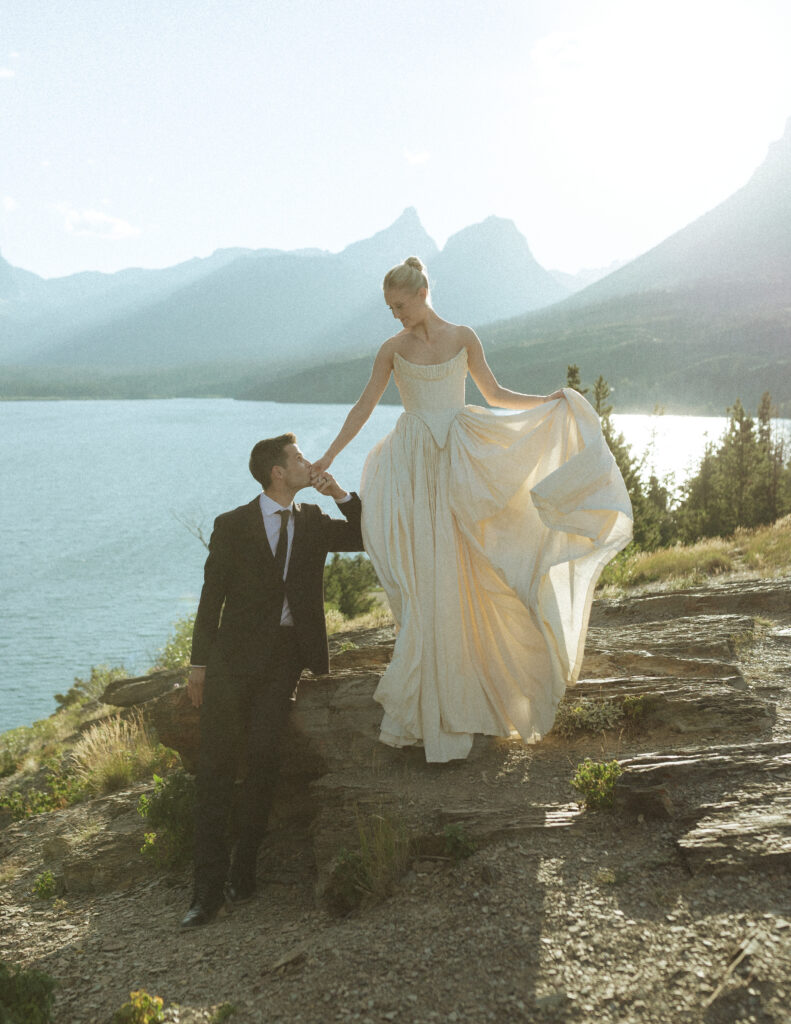 bride and groom taking wedding photos in Glacier National Park 