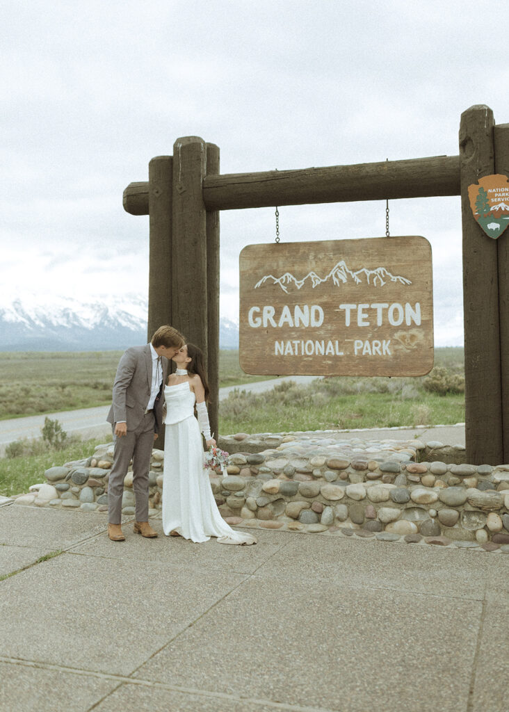 bride and groom taking wedding photos in Grand Teton National Park 